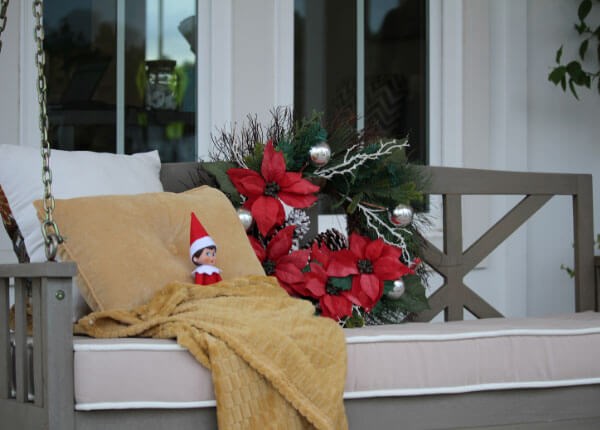 Elf on bench of porch, Pulte model home in Riverlights.