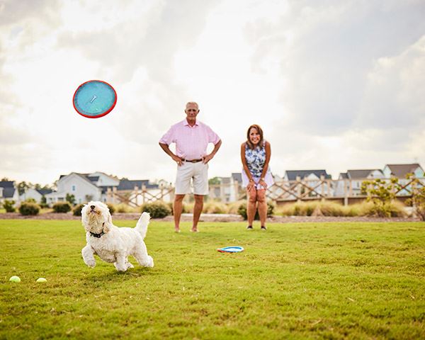 Riverlights community residents playing fetch in Wilmington, NC