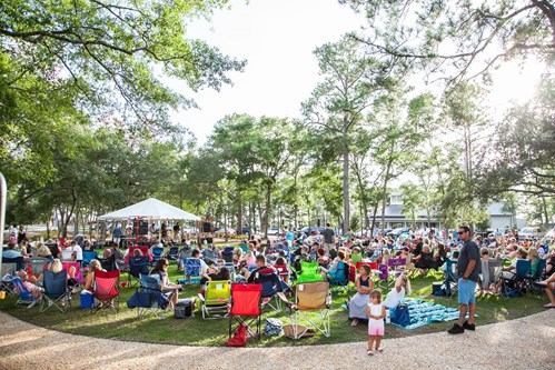 Residents and guests at outdoor concert in Riverlights