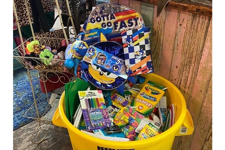 Donation bucket of school supplies for Communities in Schools