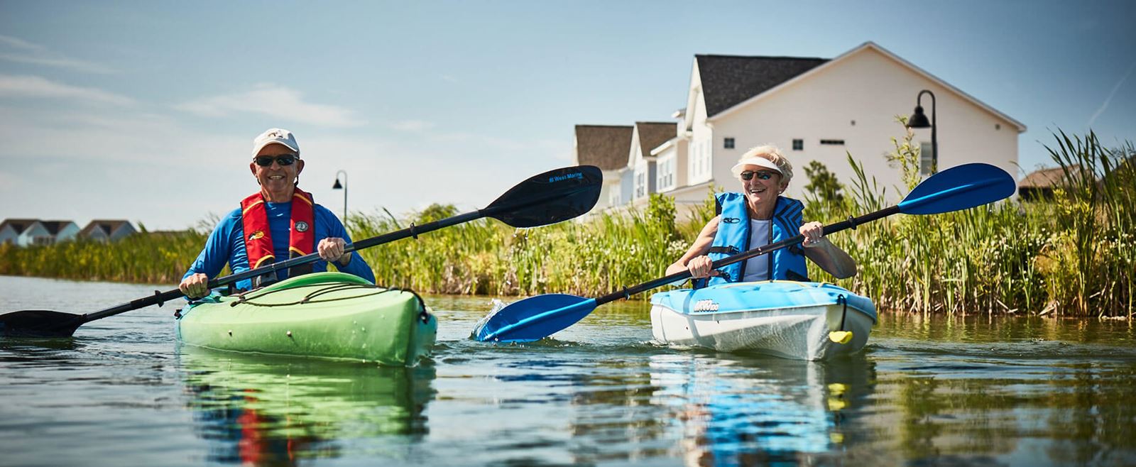 Couple kayaking on lake in Riverlights