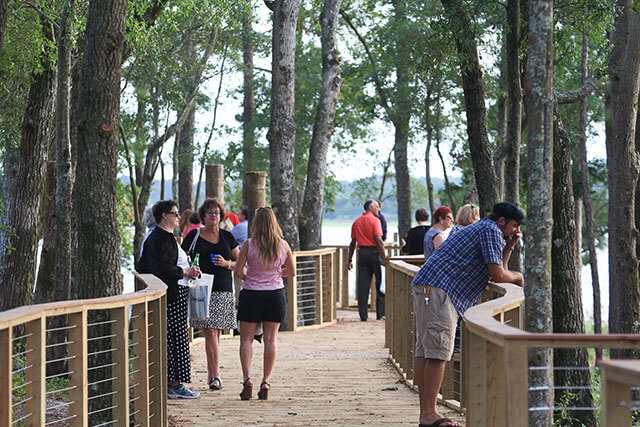 Guests enjoying the boardwalk in Riverlights.