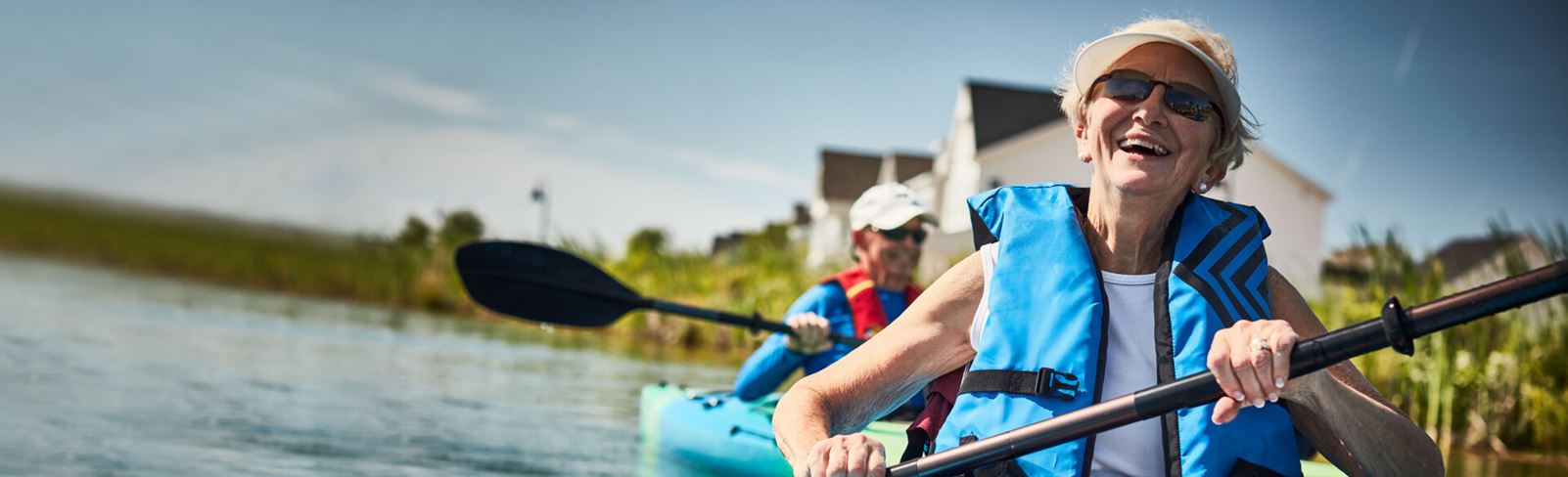 Couple kayaking on lake in Riverlights.