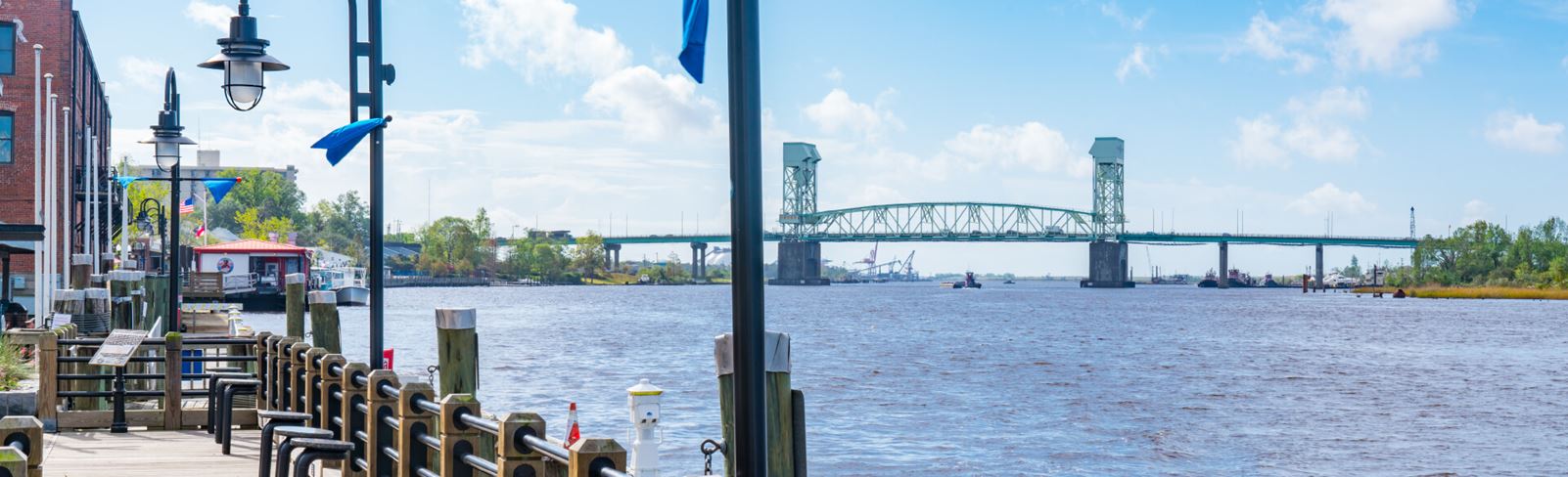 View of the Cape Fear River from riverfront boardwalk in Wilmington, NC.