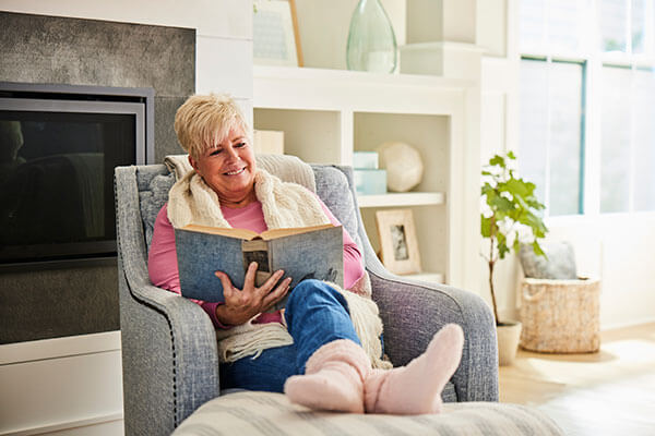 Woman relaxing in new home in Riverlights