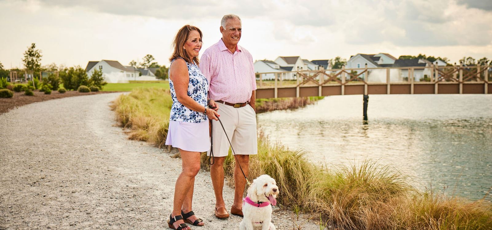 Couple walking lakeside in Riverlights.