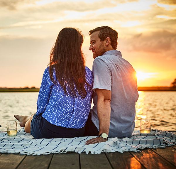 Couple enjoying sunset along the Cape Fear River in Riverlights