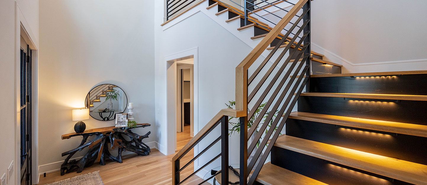 Entryway with dramatic staircase, new homes Riverlights