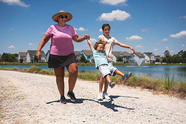 Riverlights community residents walking on the beach in Wilmington, NC